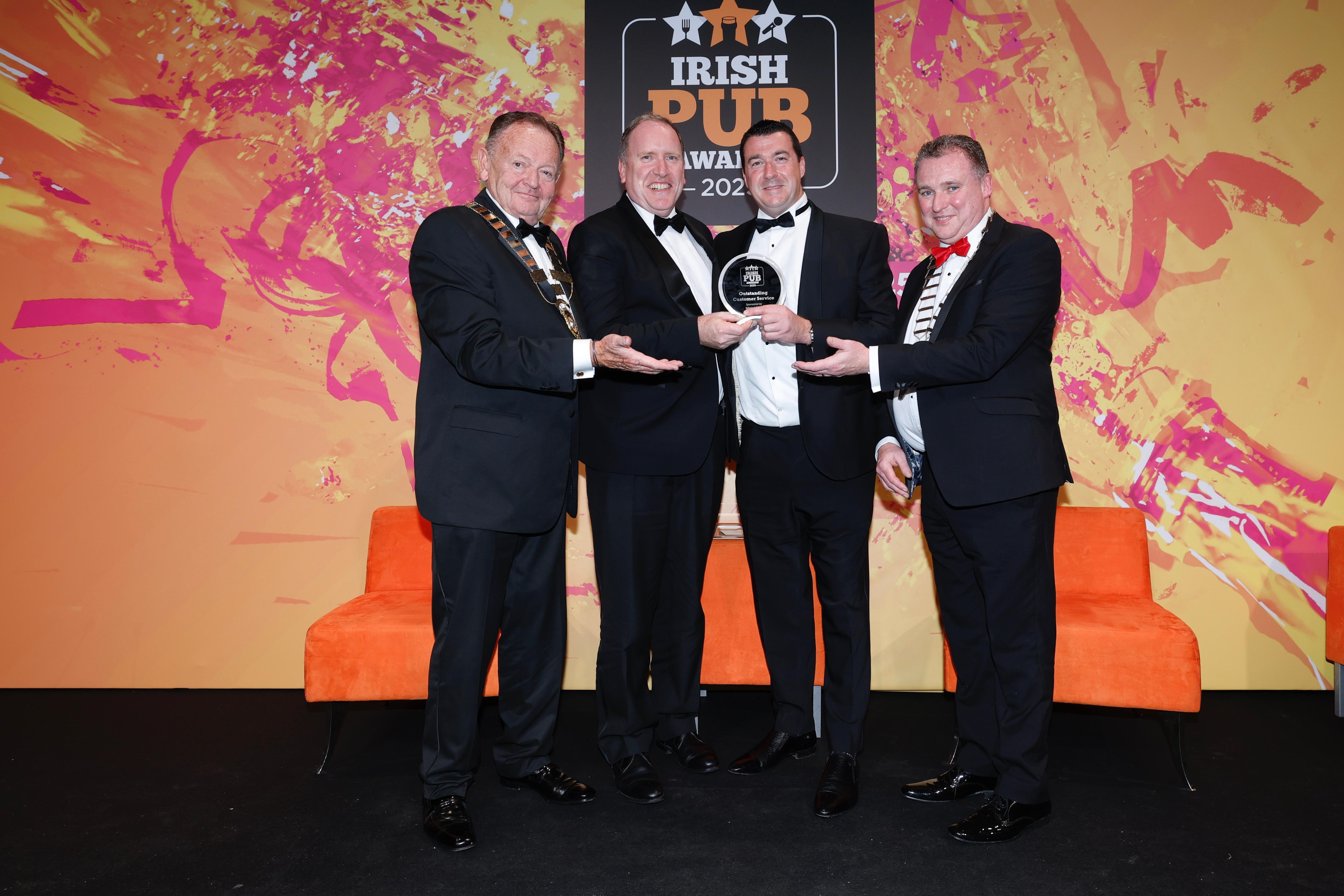 Noel Anderson of The Blackrock accepts the award for Outstanding Customer Service at the Irish Pub Awards 2025